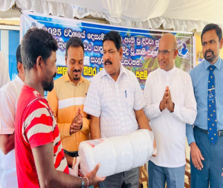 Minister Ramalingam Chandrasekhar presents new boats and gear to fishermen in Chilaw affected by Cyclone Ditwa
